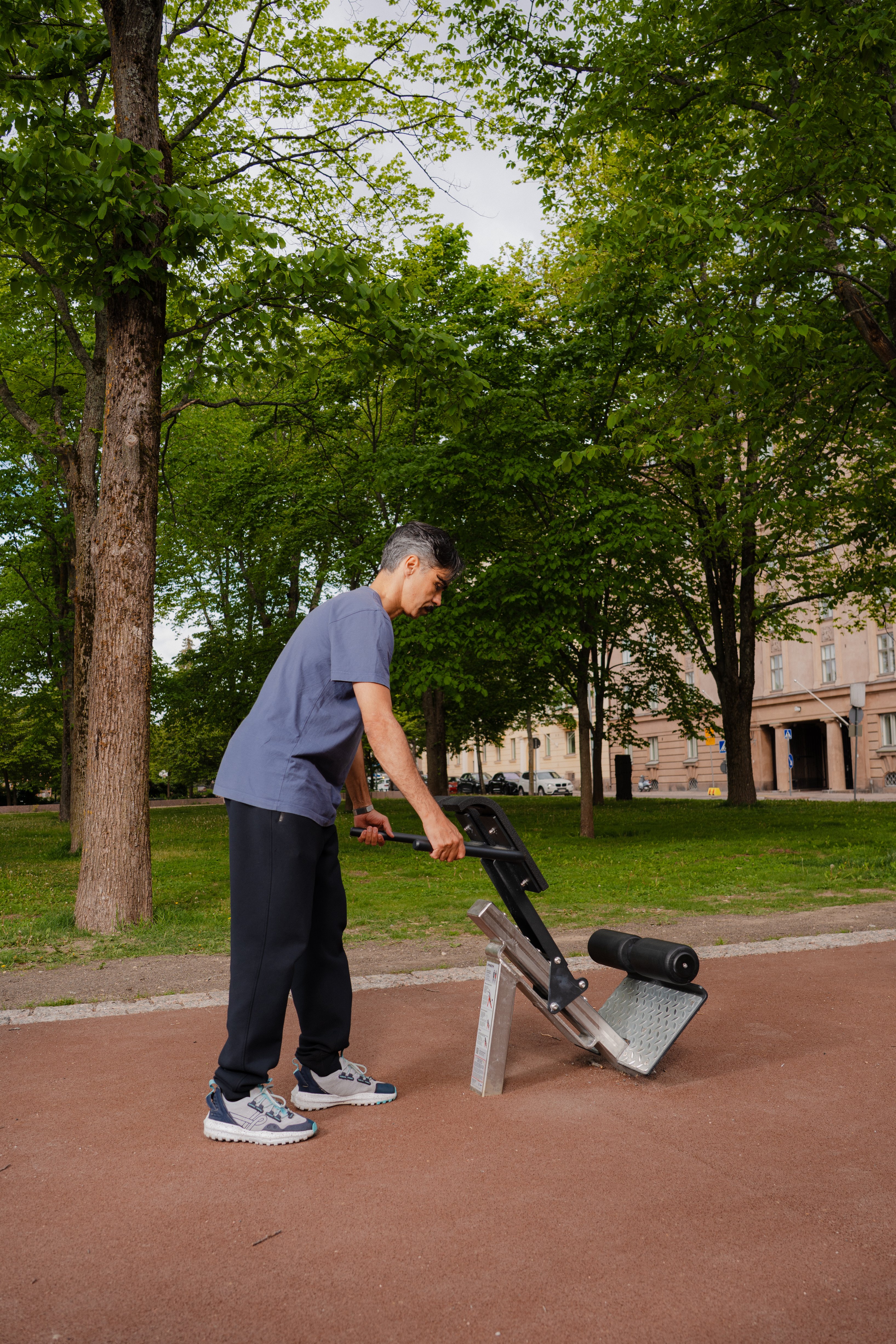 A man adjusting Omnigym back extension rack