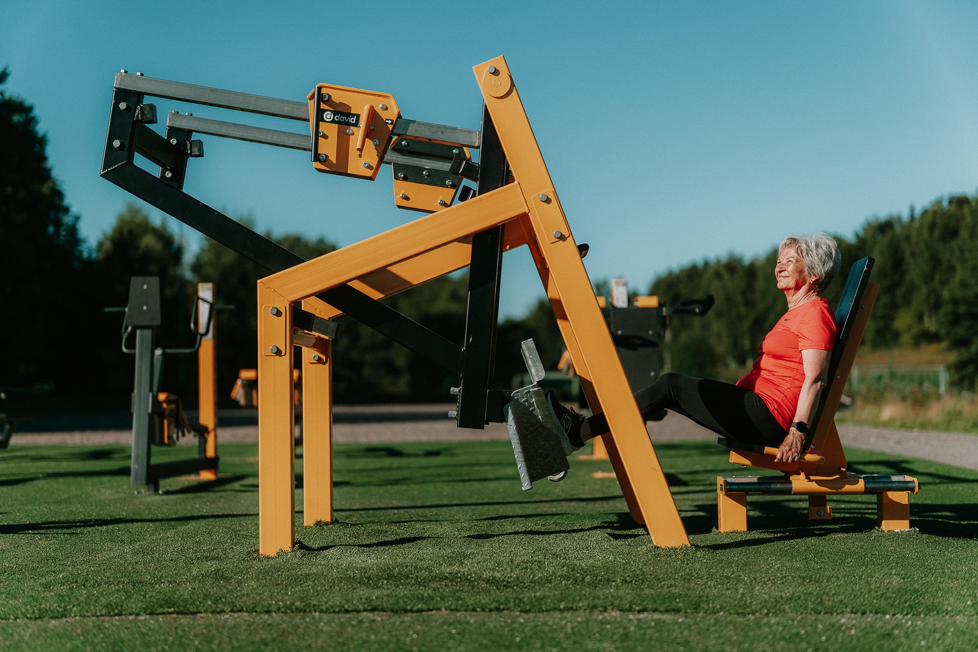 A senior using leg press 