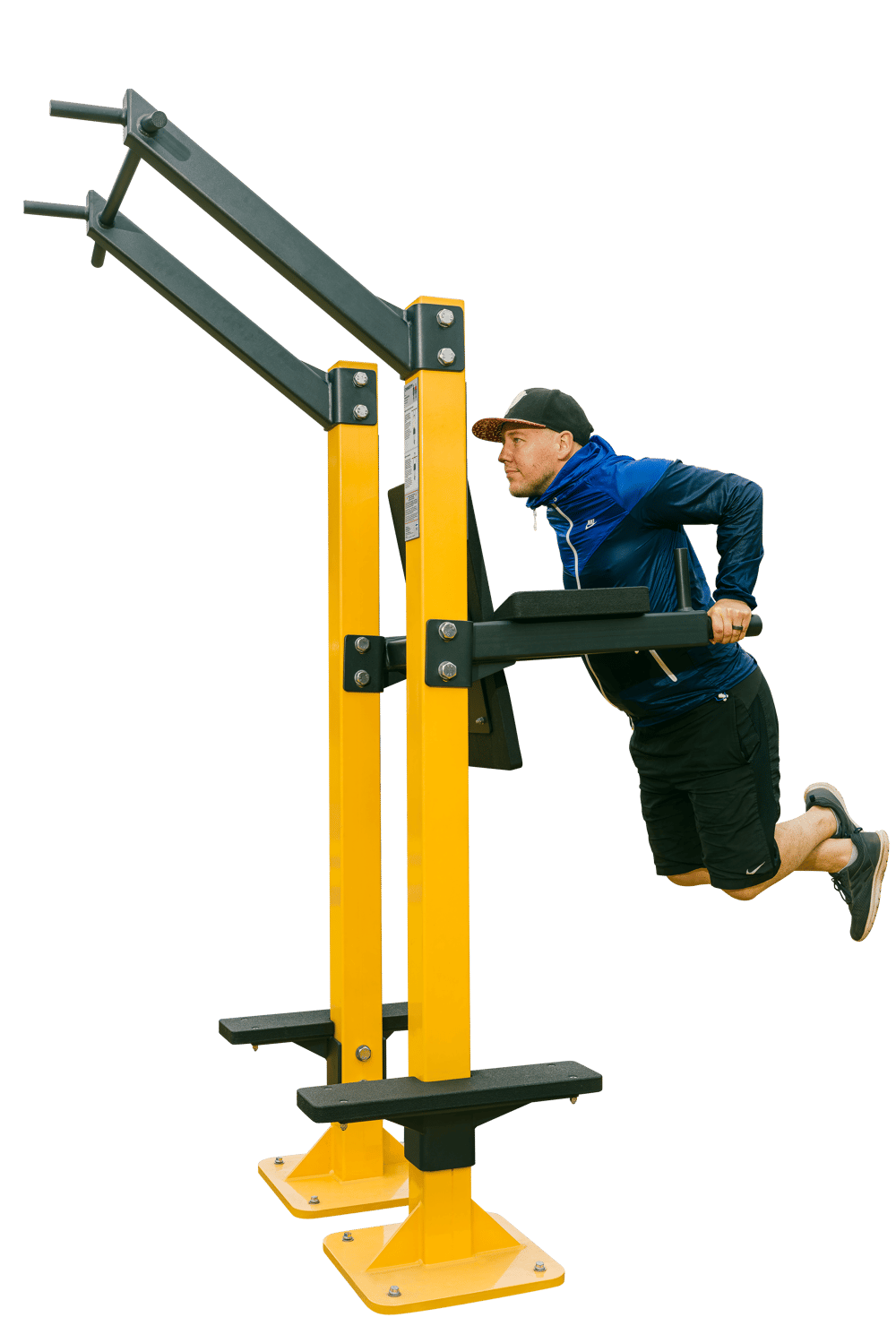 A man doing dips in the OG95 from Omnigym, a combination of dips and chinup bars and leg raise handles. A man doing dips in the OG95 from Omnigym, a combination of dips and chinup bars and leg raise handles.