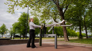 a woman at an outdoor gym in Helsinki Meripuisto